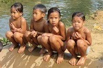 Laos, children playing near Phathao Caves (2020)